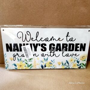 Sign "Welcome to NANNY'S GAREDN Grown with Love"